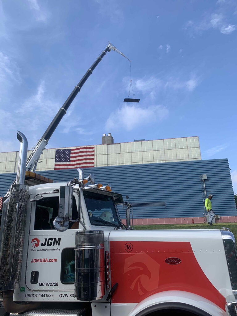 JGM truck in front of building site