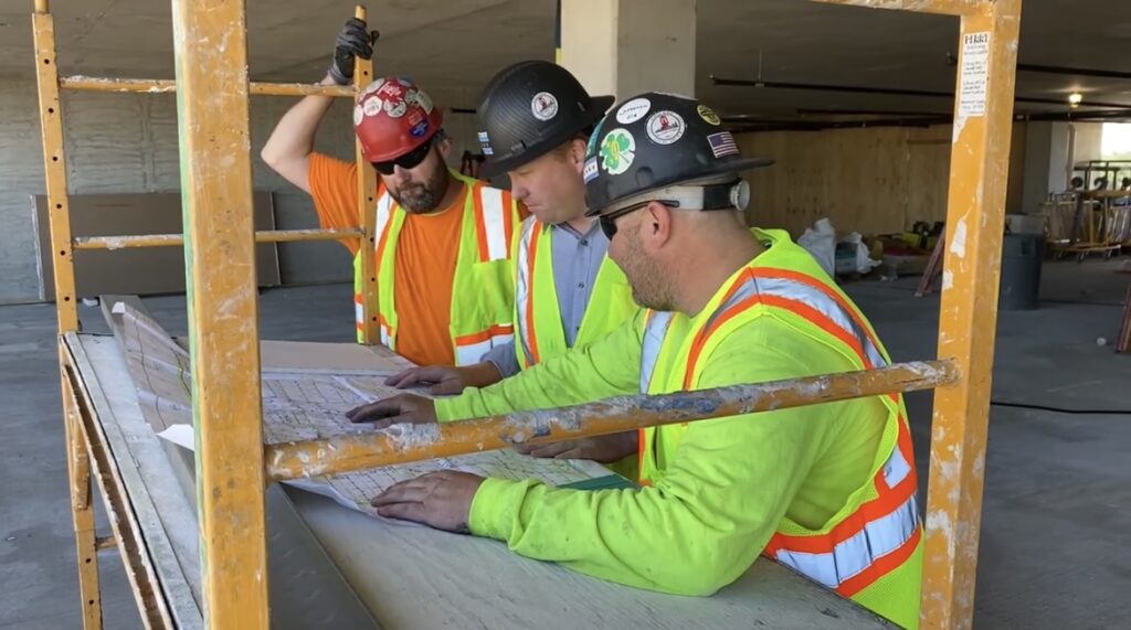 Chicago Fire Protection workers planning looking at drawing