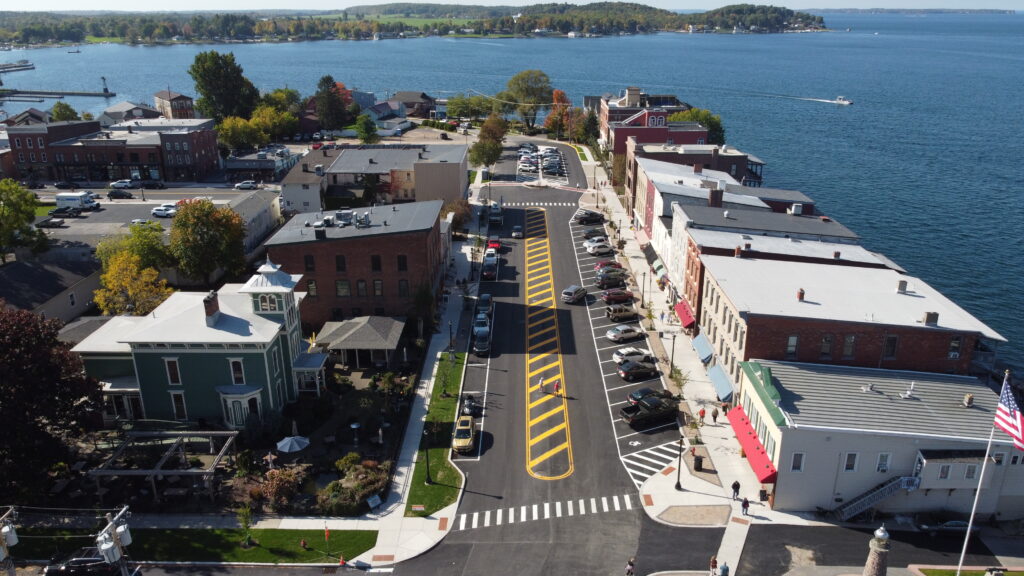 aerial view of street parallel to lake