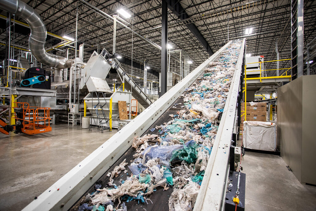 brightmark facility interior showing conveyor with different grades of plastics about to be sorted