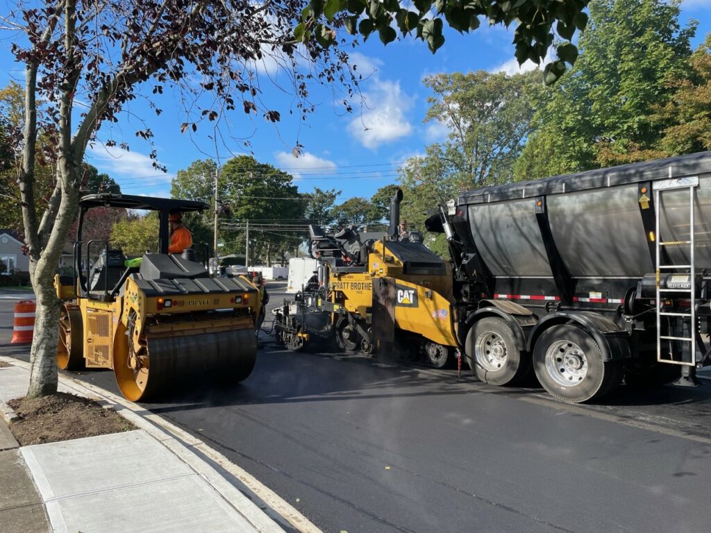Pratt Brothers paving a road with heavy construction equipment