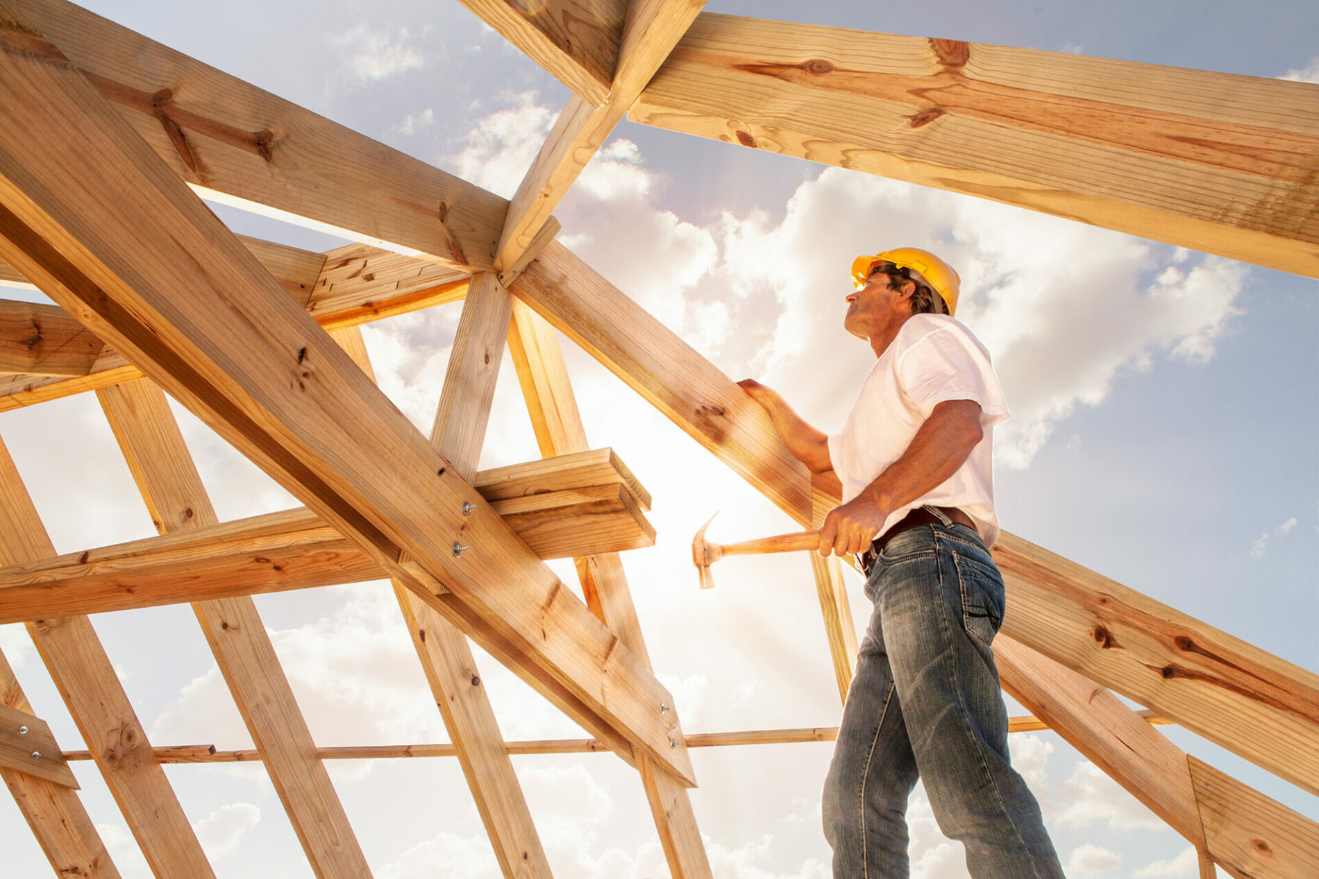 roofer building a wooden structure frame