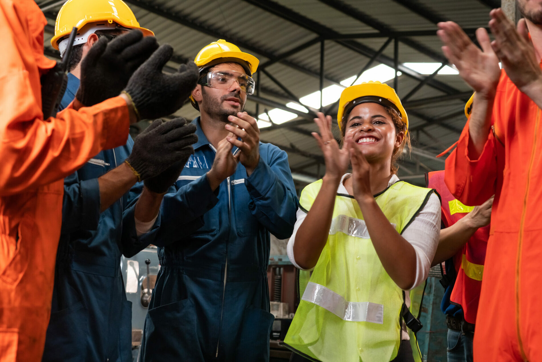 Skillful worker celebrate success in the factory . Industrial people and manufacturing labor concept .