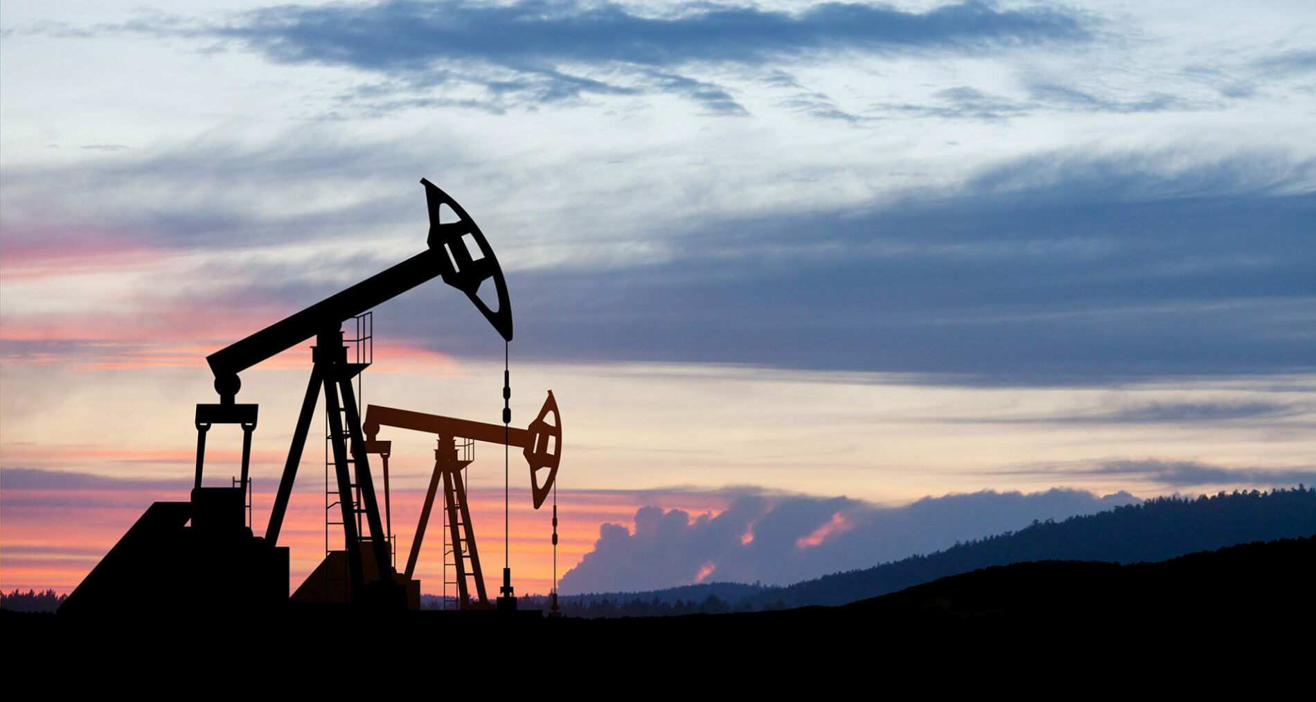 Oil drilling derricks at desert oilfield. The change in oil prices caused by the war. Oil prices are rising.