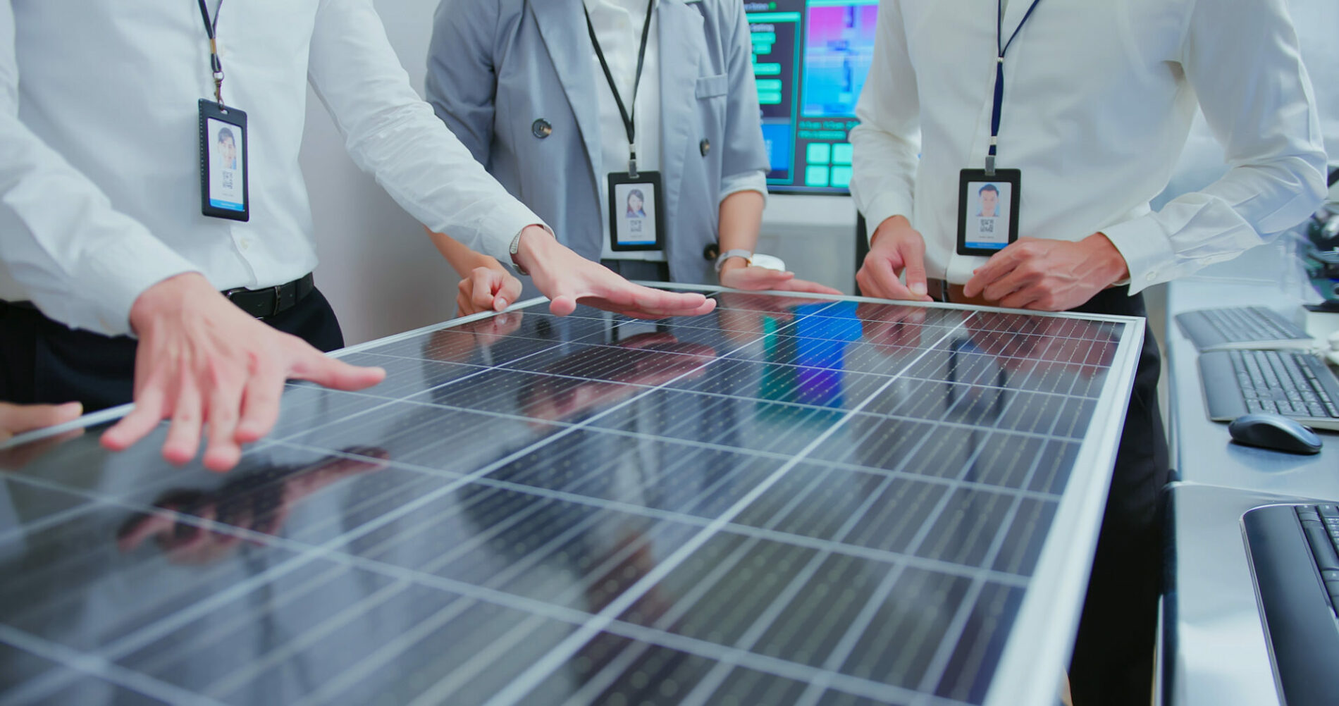 close up of asian engineer team have meeting and discussing solar panel projects in office