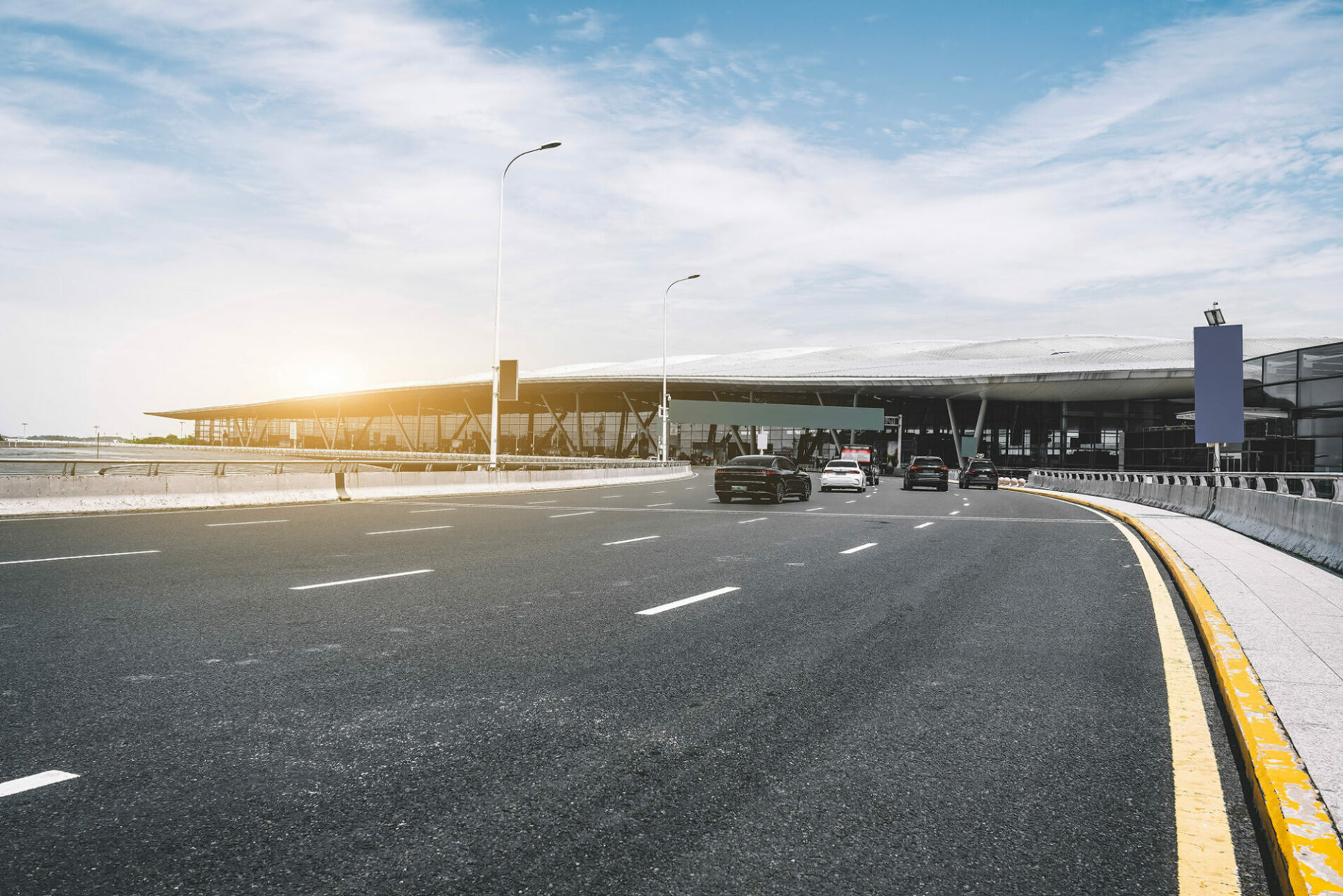 Modern Airport Terminal and Roadway at Sunrise